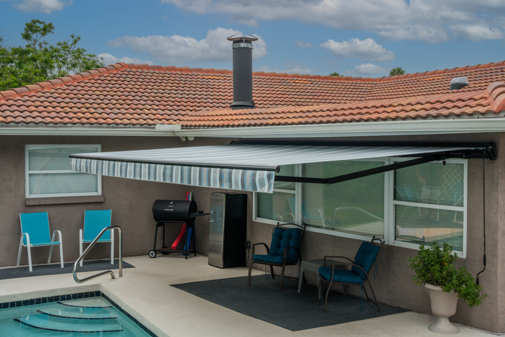 retractable awning with green and white stripes